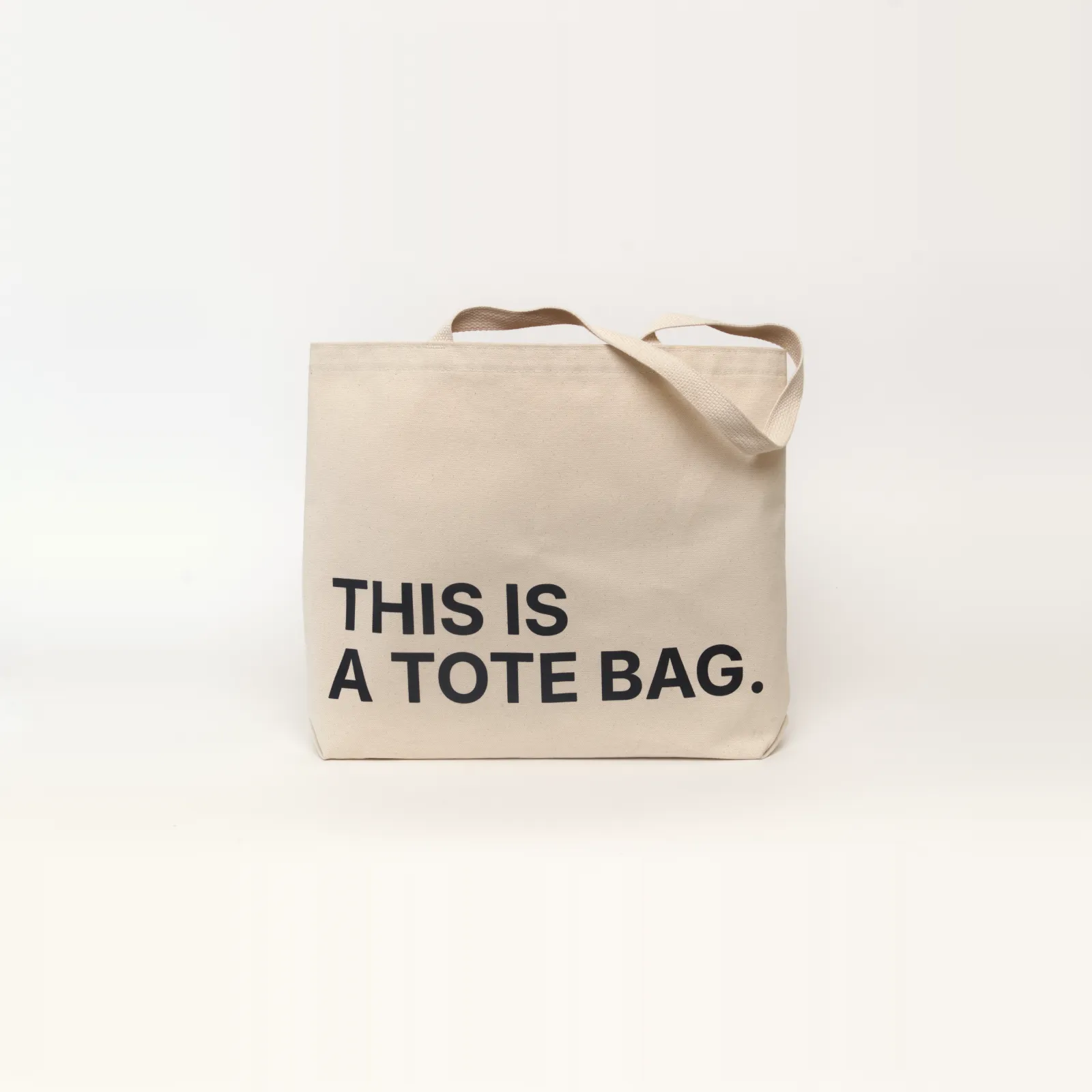 Natural tote bag that says THIS IS A TOTE BAG